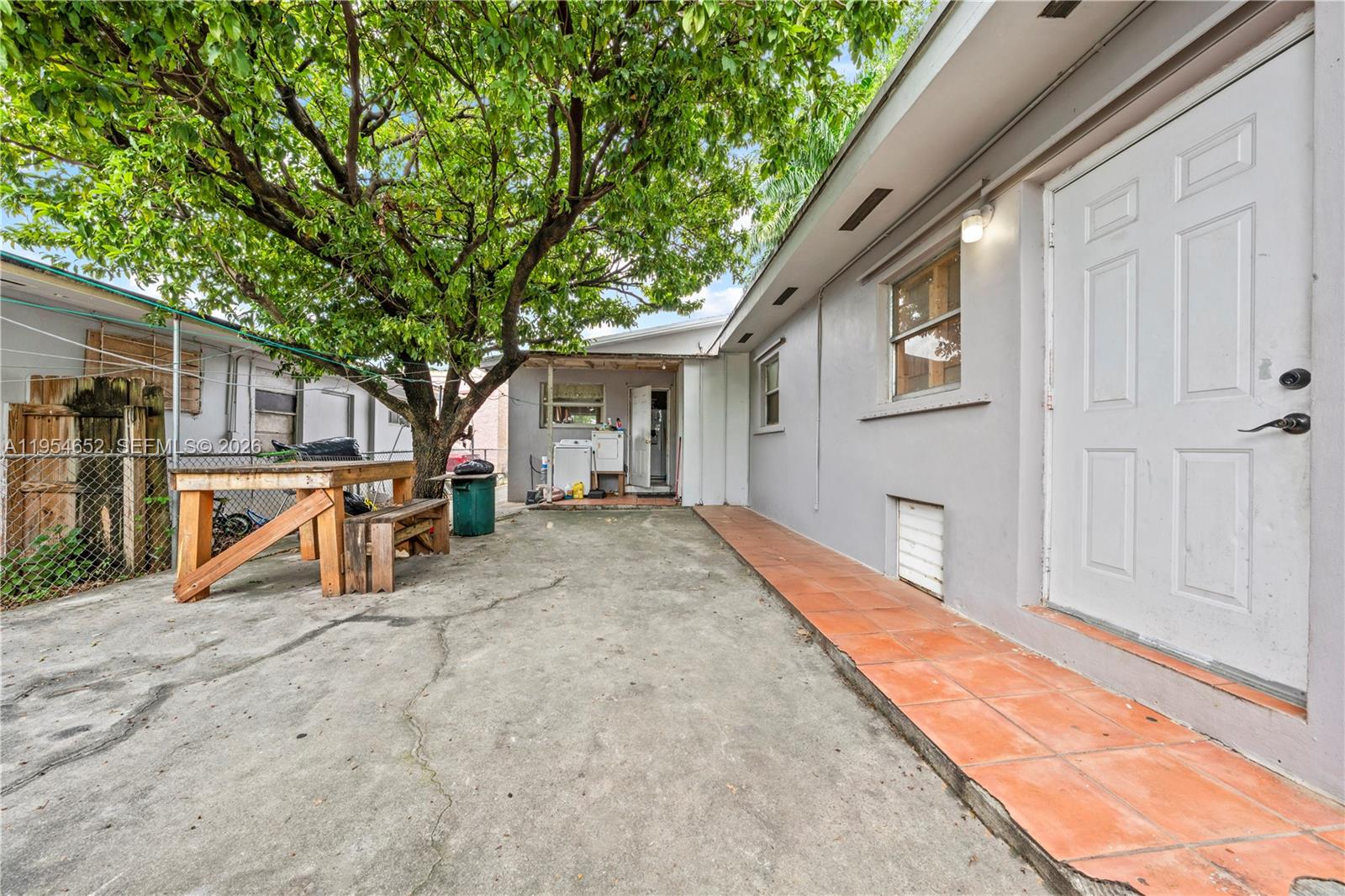 2110 Northwest 34th Street Miami, FL 33142 - Photo 32 of 33 a view of a house with backyard and sitting area