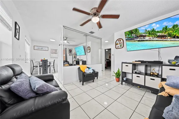 a view of kitchen with white cabinets furniture and white appliances