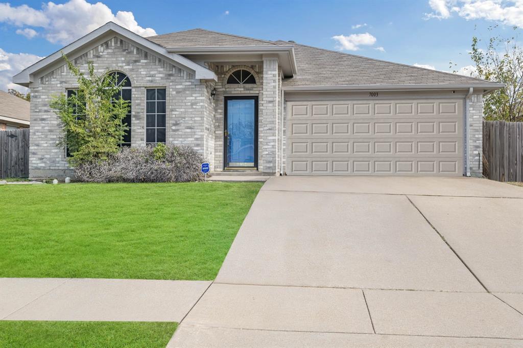 7003 Rovato Drive Arlington, TX 76001 - Photo 1 of 1 a front view of a house with a yard and garage