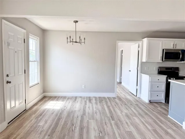 a view of kitchen and wooden floor