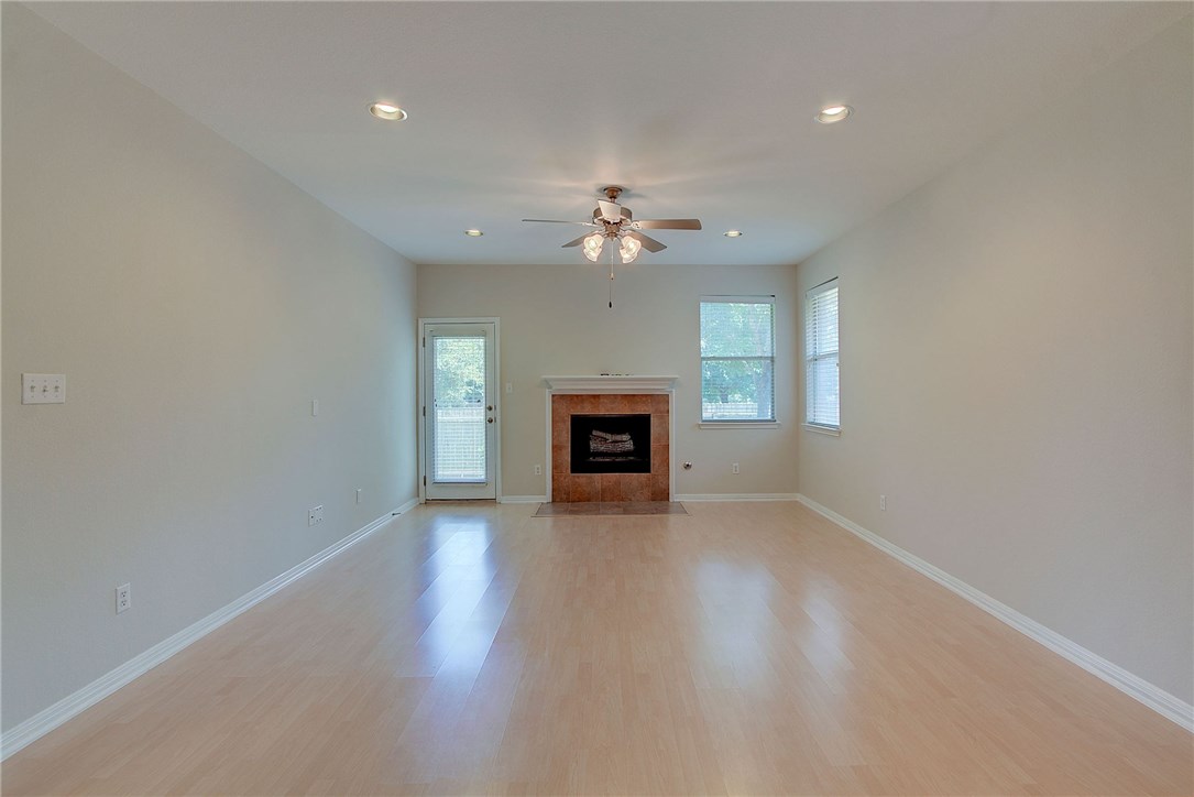 2993 Freemont Street Round Rock, TX 78681 - Photo 14 of 32 wooden floor in an empty room with a window