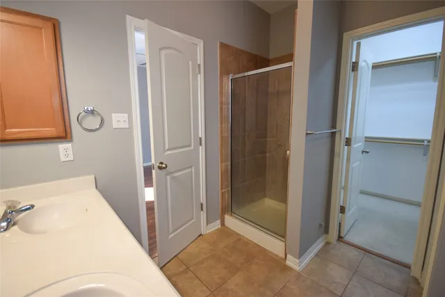 a bathroom with a tub and shower