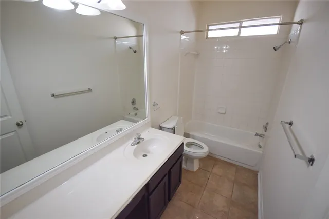 a bathroom with a tub sink toilet and a shower