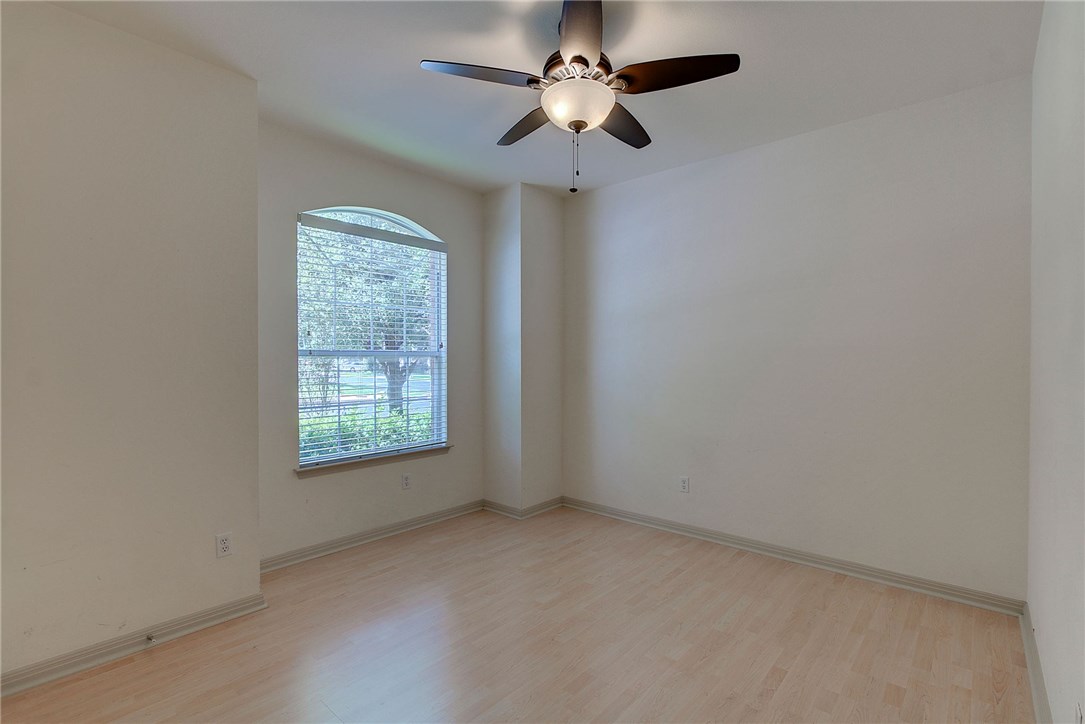2993 Freemont Street Round Rock, TX 78681 - Photo 23 of 32 an empty room with a window and a fan