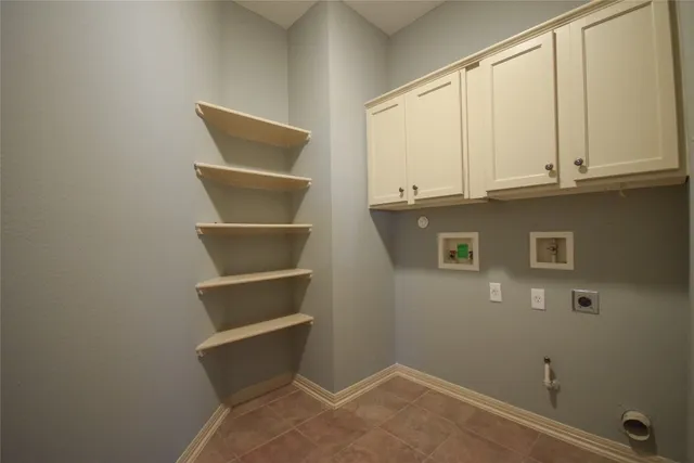 a view of an empty room with cabinet