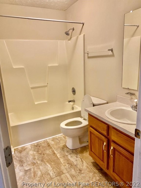 1945 Sardonyx Road, Unit 4 Fayetteville, NC 28303 - Photo 15 of 17 a bathroom with a sink a toilet and a bathtub