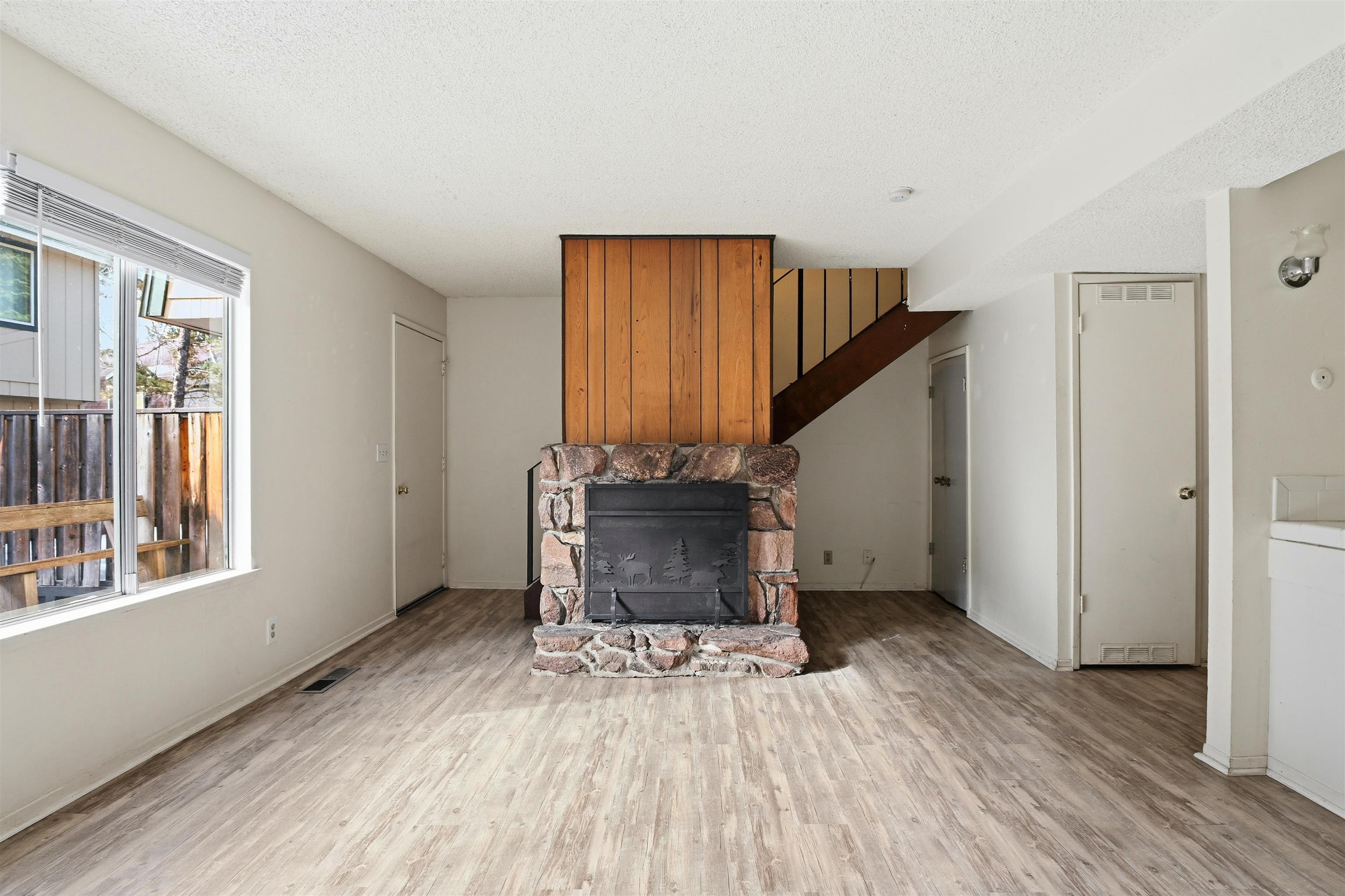 3101 Lake Forest Road, Unit 57 Tahoe City, CA 96145 - Photo 6 of 26 a view of an entryway with wooden floor and stairs