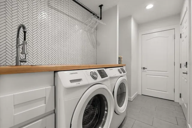 a utility room with dryer and washer