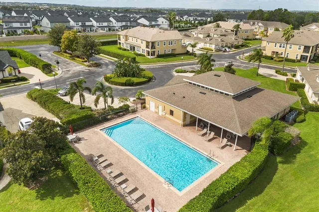 an aerial view of residential houses with outdoor space
