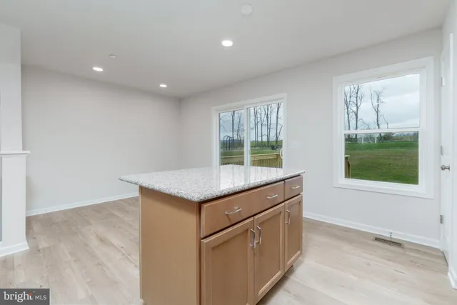 an empty room with windows and entrance