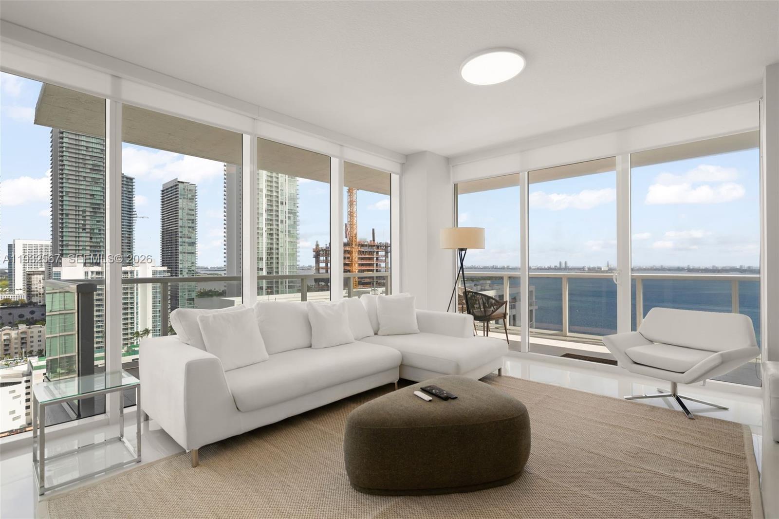 600 Northeast 27th Street, Unit 2401 Miami, FL 33137 - Photo 12 of 52 a living room with furniture and floor to ceiling windows