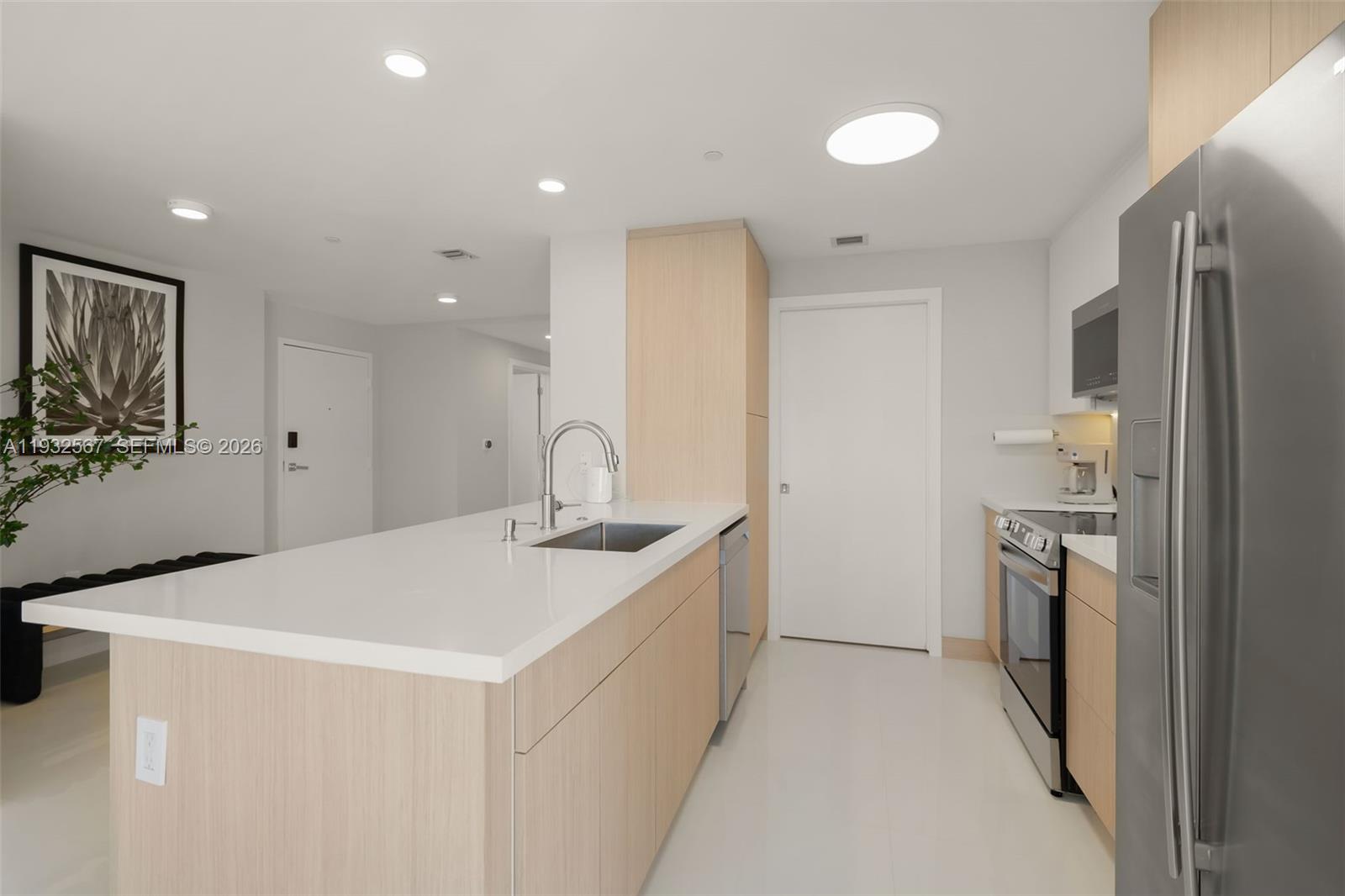 600 Northeast 27th Street, Unit 2401 Miami, FL 33137 - Photo 13 of 52 a kitchen with a sink and stainless steel appliances