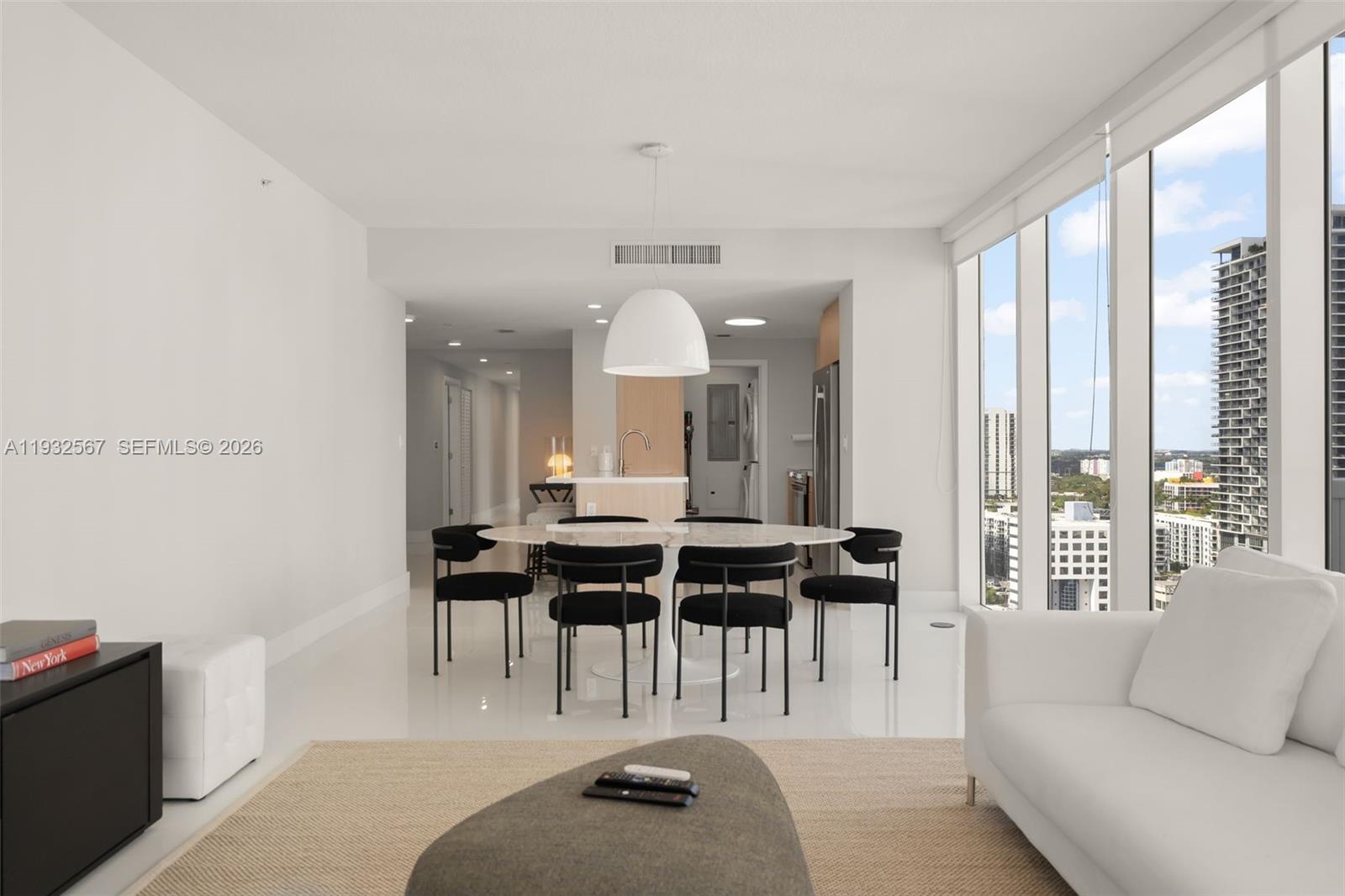 600 Northeast 27th Street, Unit 2401 Miami, FL 33137 - Photo 14 of 52 a living room with furniture and a large window