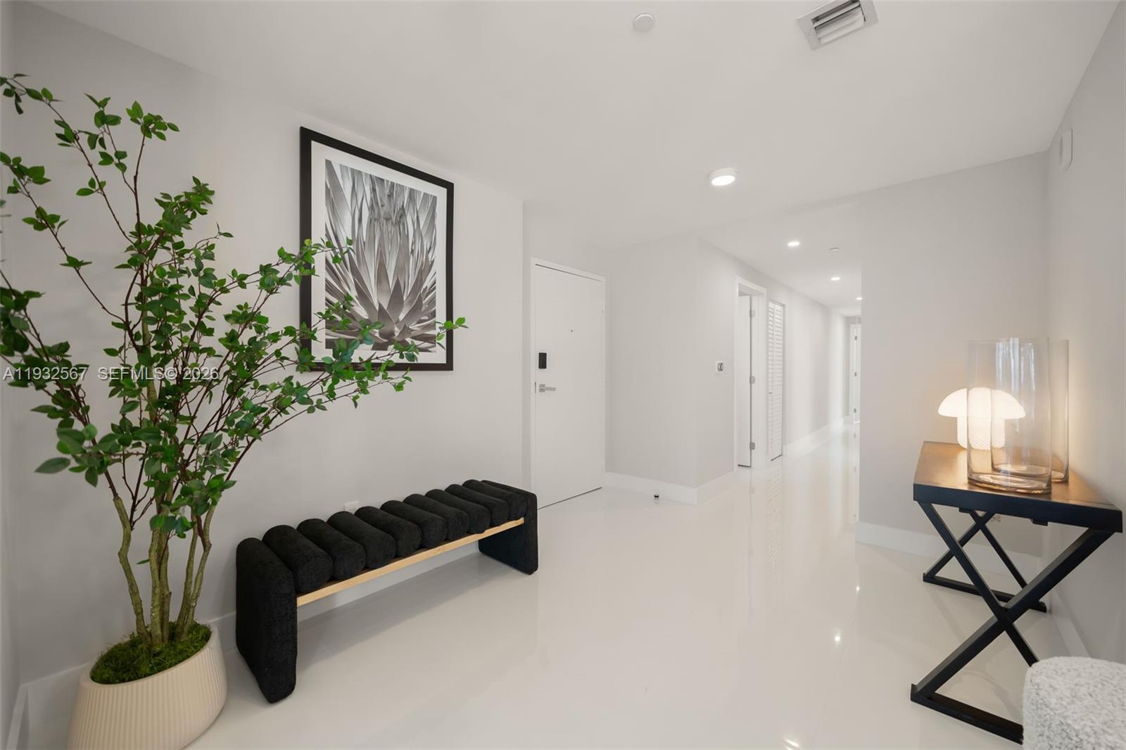 600 Northeast 27th Street, Unit 2401 Miami, FL 33137 - Photo 15 of 52 a room with gym equipment and a potted plant
