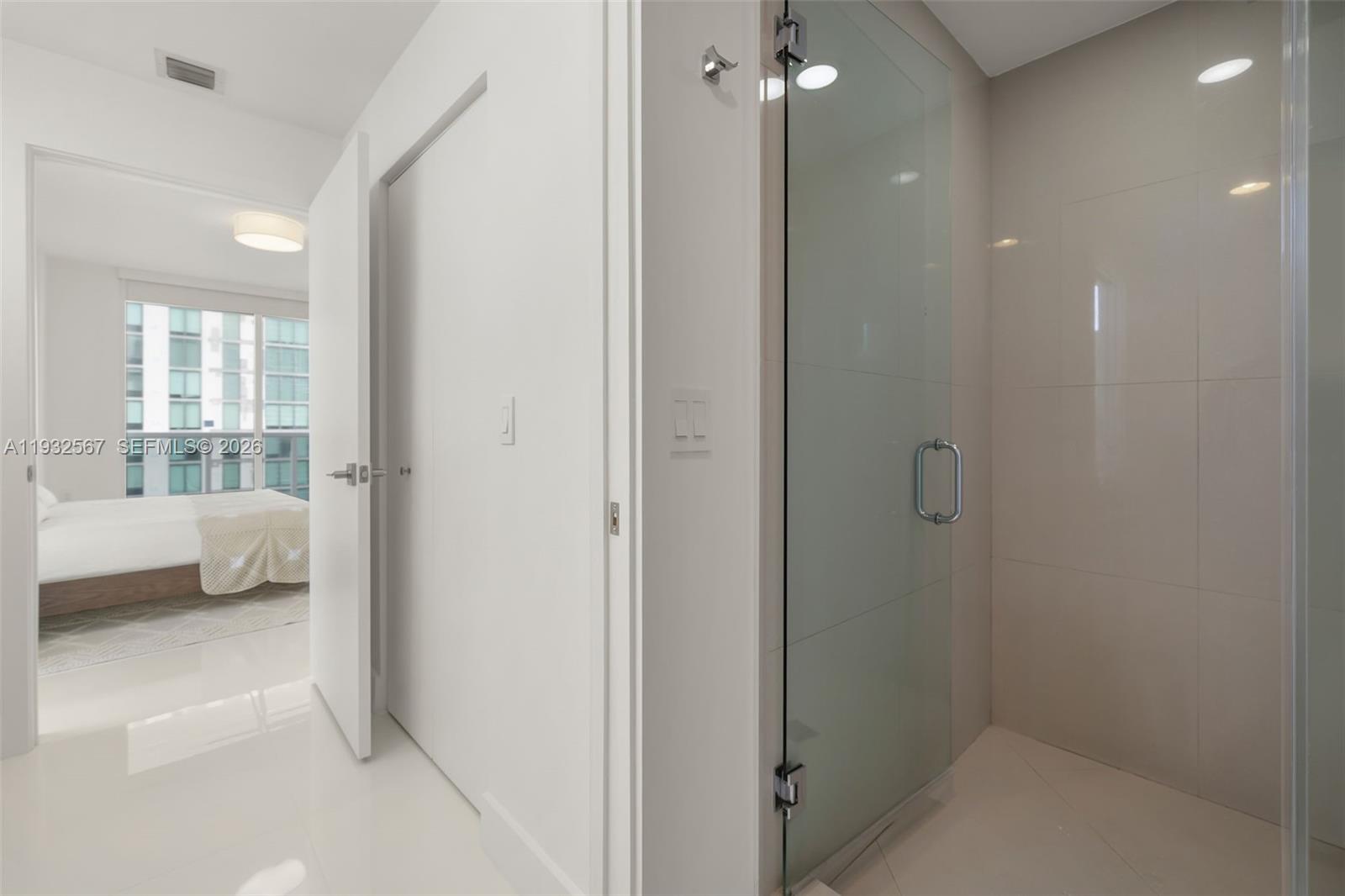 600 Northeast 27th Street, Unit 2401 Miami, FL 33137 - Photo 24 of 52 a en suite bathroom with a shower