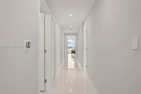 a bedroom with a bed and lamp