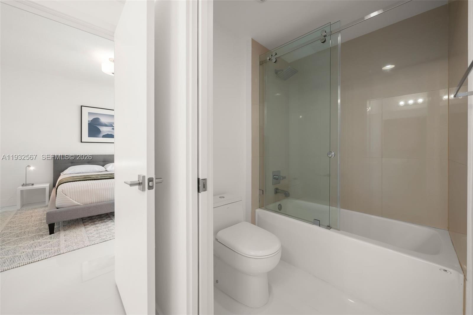 600 Northeast 27th Street, Unit 2401 Miami, FL 33137 - Photo 33 of 52 a bathroom with a toilet a sink and shower