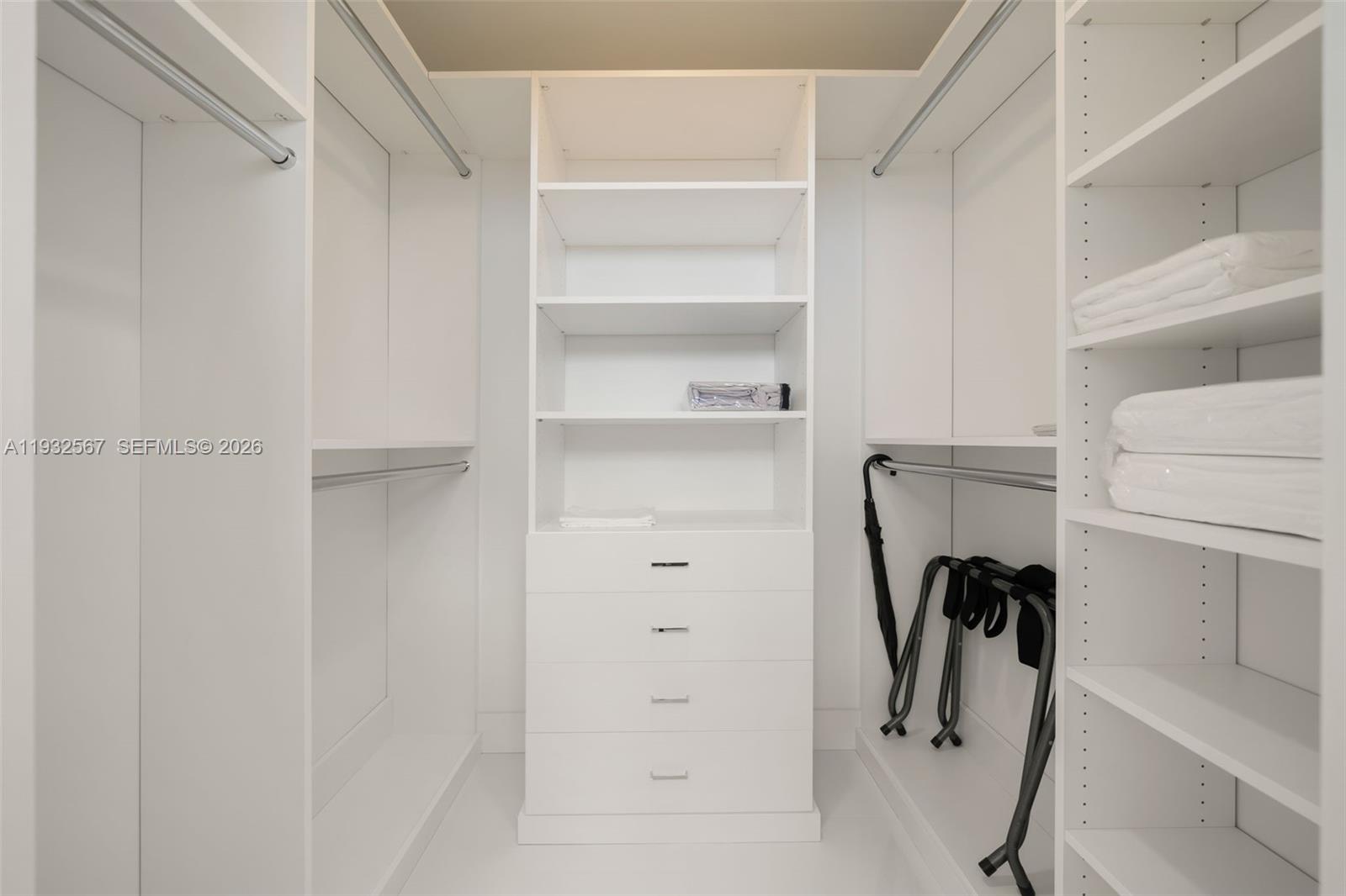 600 Northeast 27th Street, Unit 2401 Miami, FL 33137 - Photo 35 of 52 a view of walk in closet with empty racks