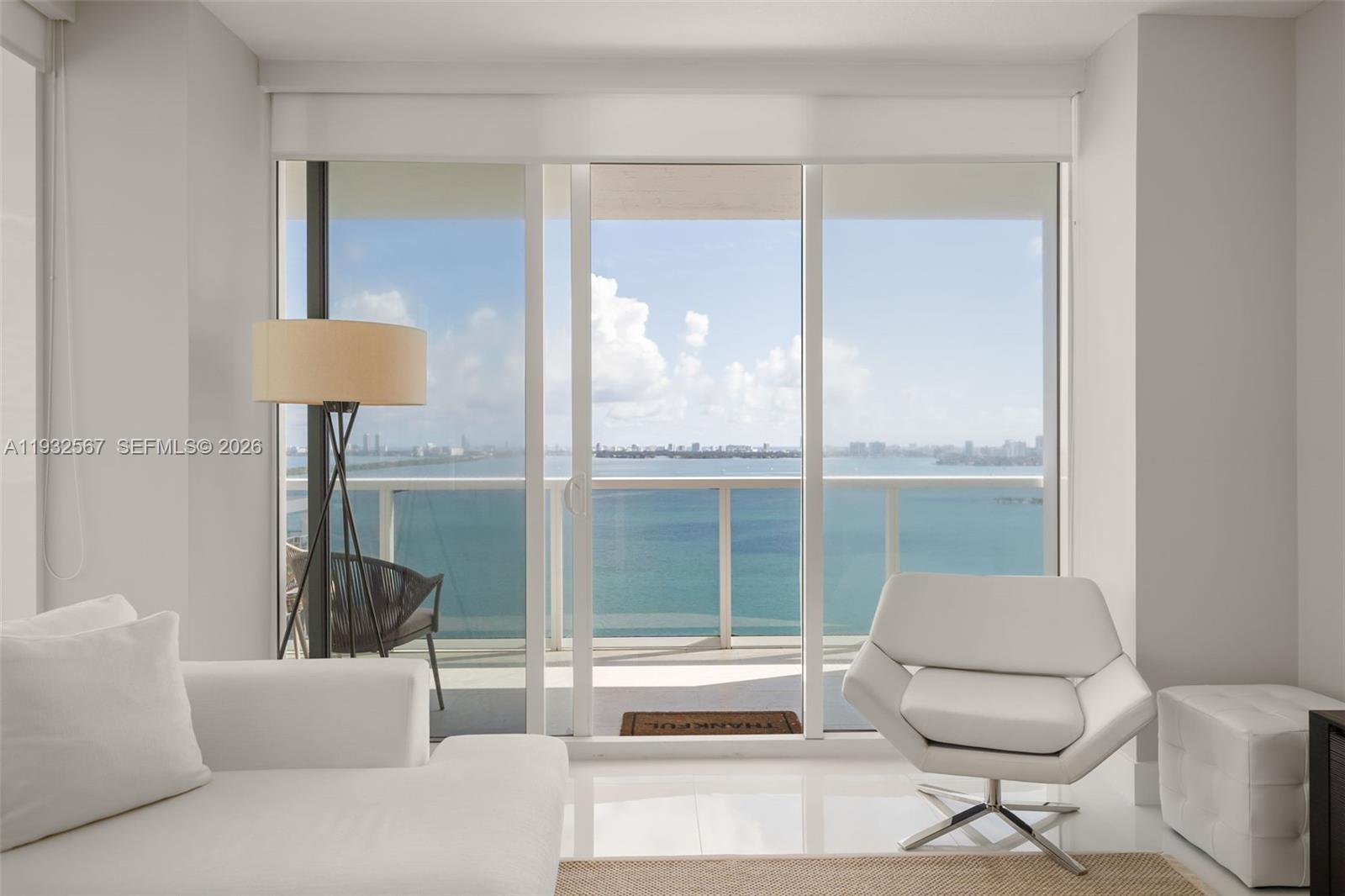 600 Northeast 27th Street, Unit 2401 Miami, FL 33137 - Photo 4 of 52 a living room with furniture and a large window