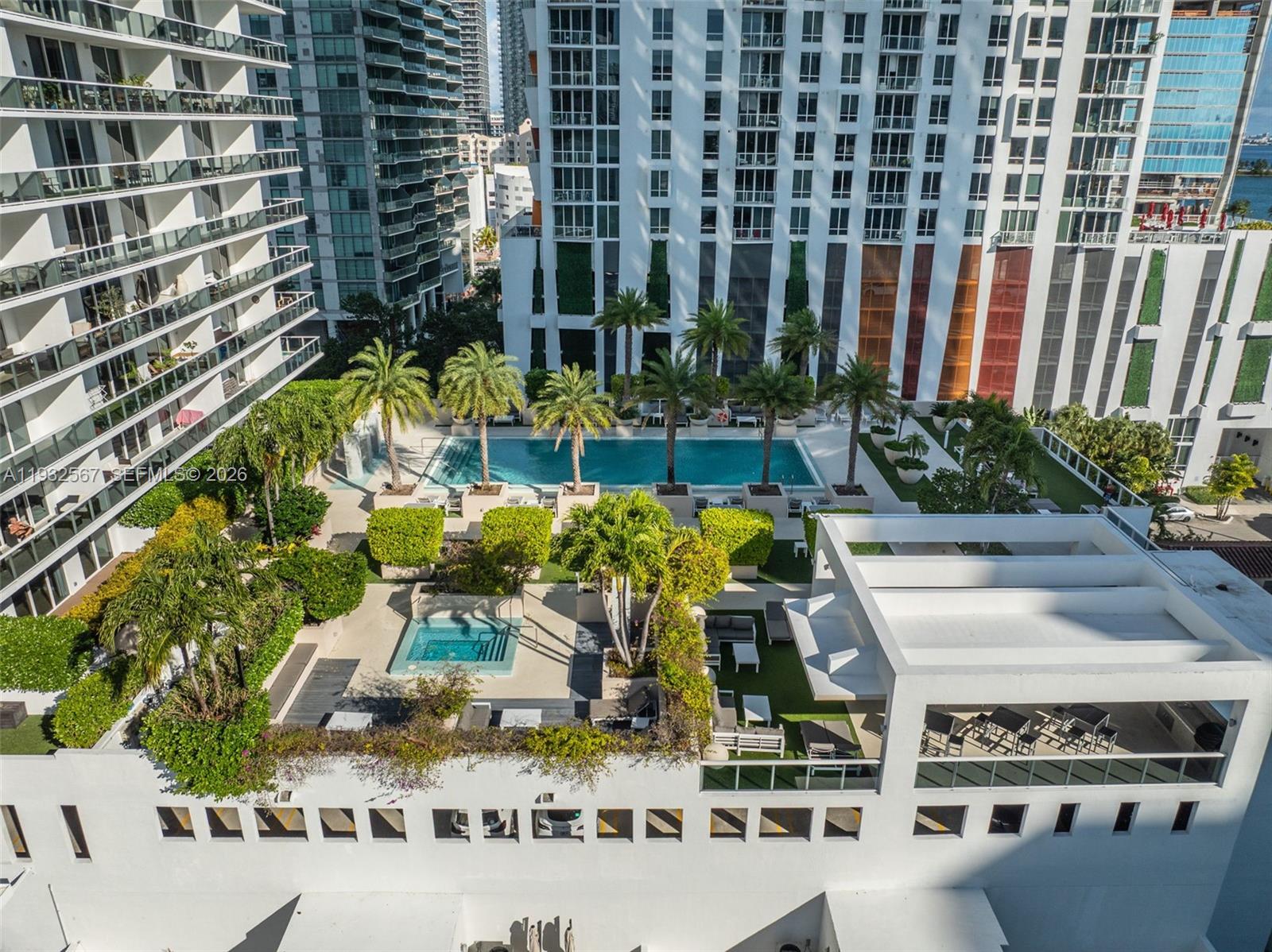 600 Northeast 27th Street, Unit 2401 Miami, FL 33137 - Photo 47 of 52 a view of a patio with couches table and chairs and potted plants