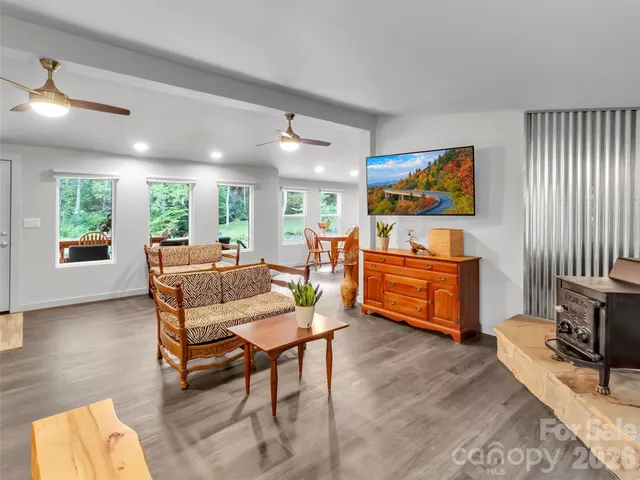 a dining room with furniture a window and stainless steel appliances