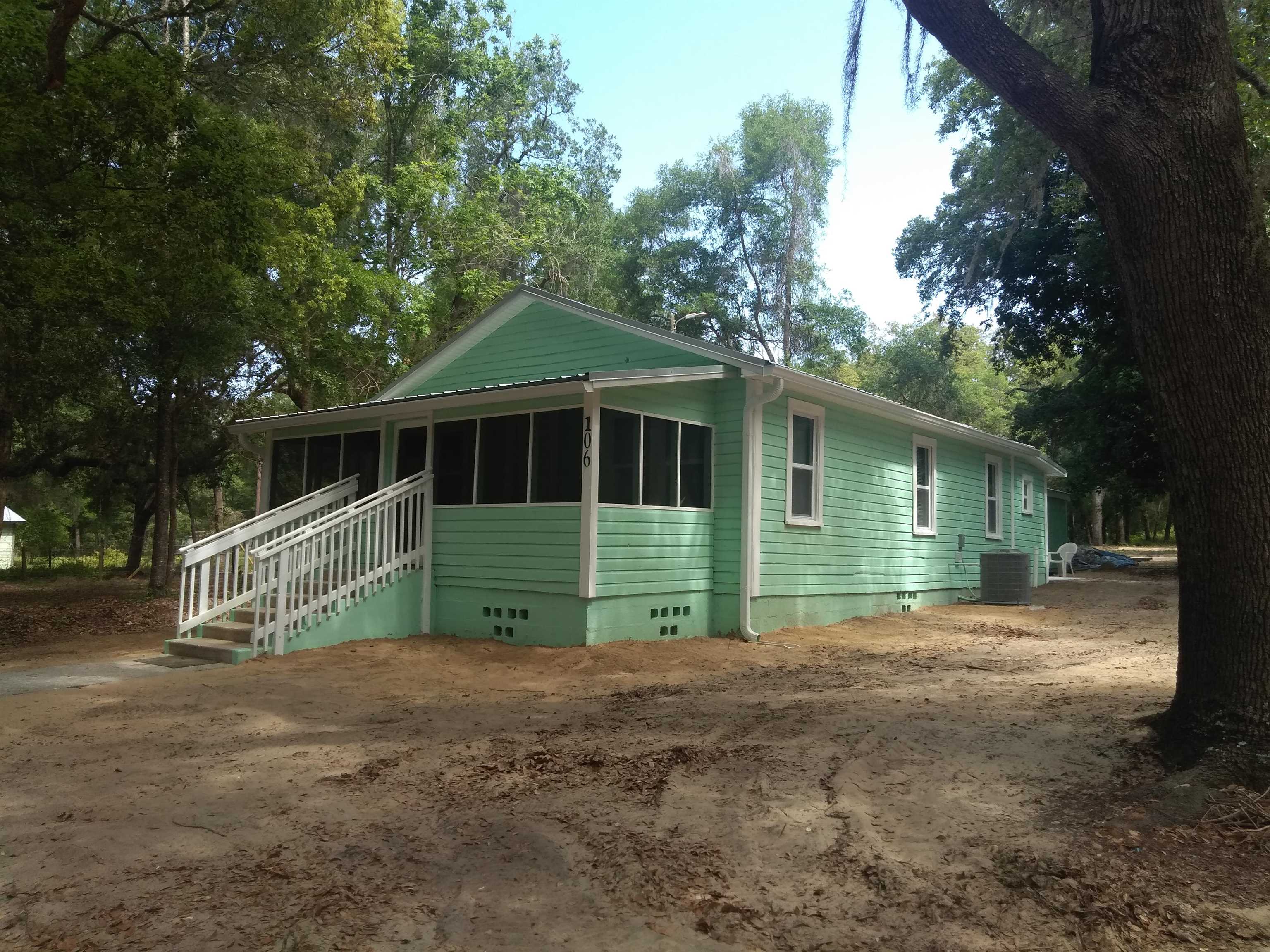 106 Putnam Loop Road Melrose, FL 32666 - Photo 17 of 28 a view of house with outdoor space and trees around