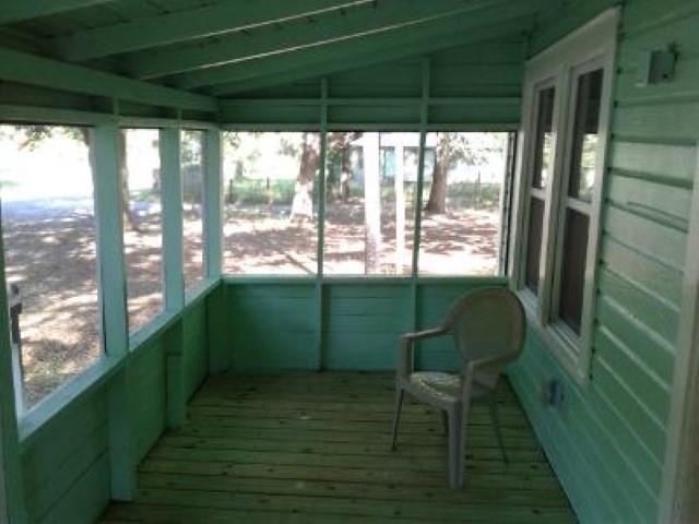 106 Putnam Loop Road Melrose, FL 32666 - Photo 20 of 28 a view of a porch with chairs and backyard