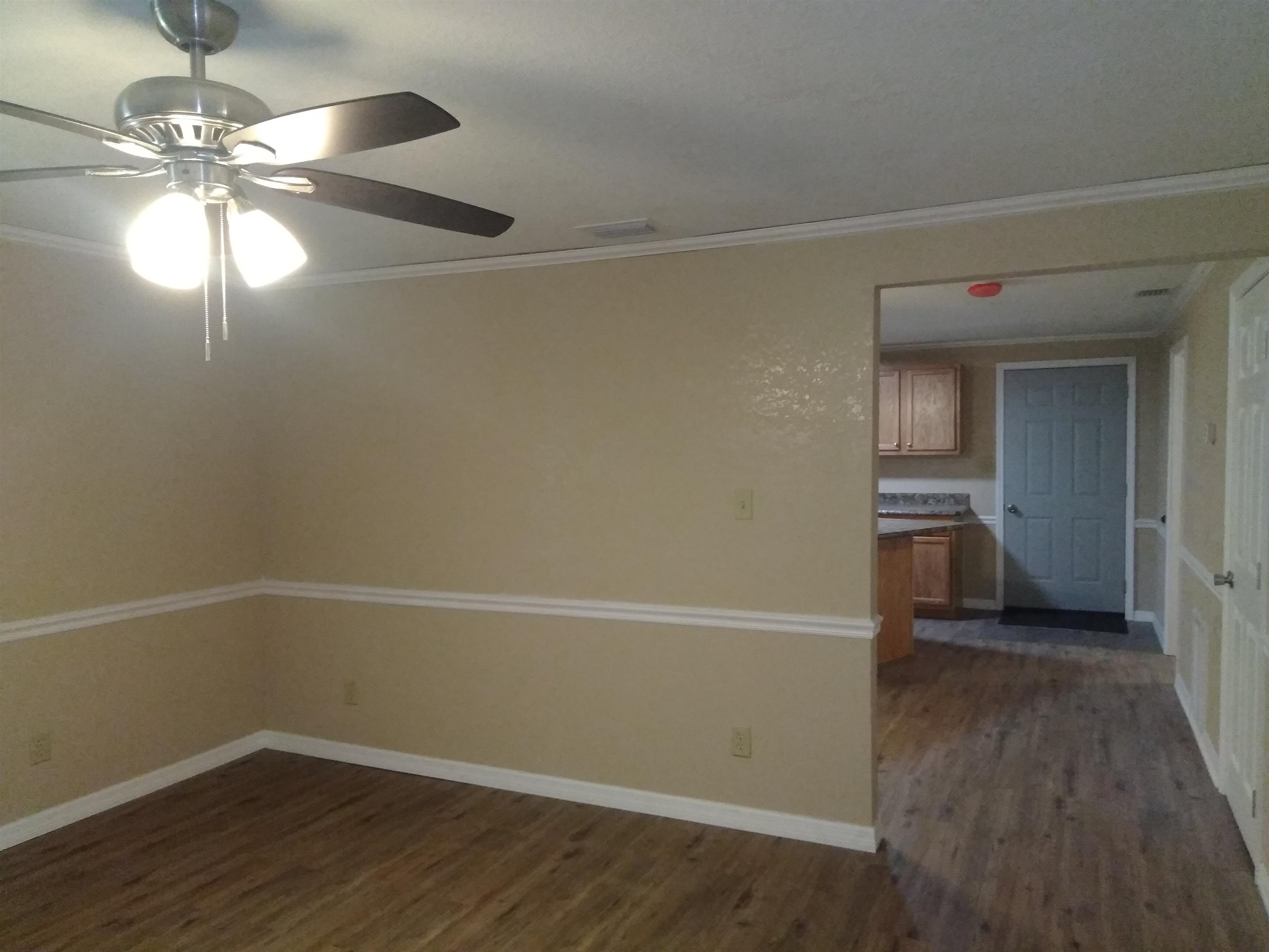 106 Putnam Loop Road Melrose, FL 32666 - Photo 2 of 28 a view of an empty room with wooden floor