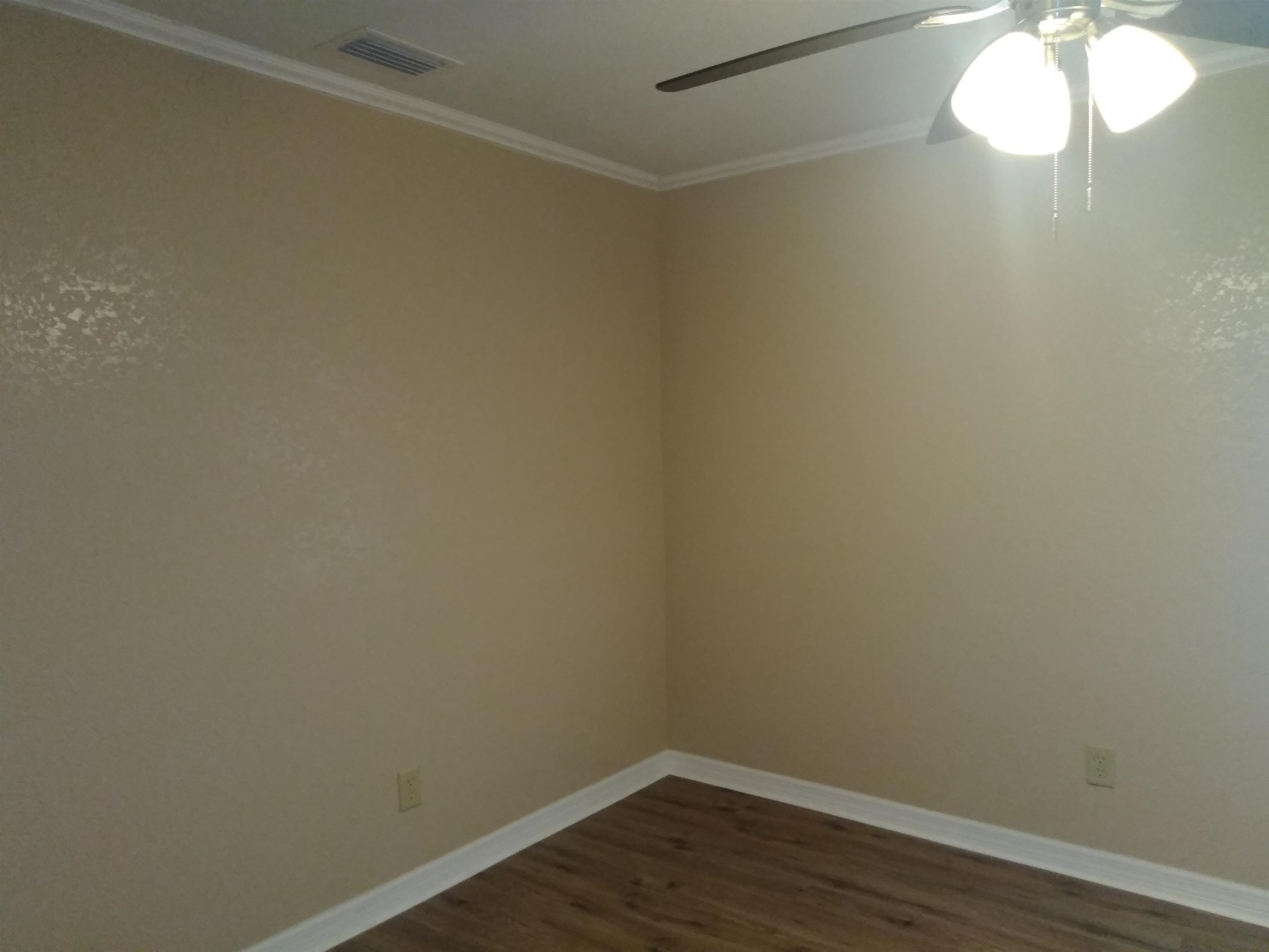 106 Putnam Loop Road Melrose, FL 32666 - Photo 8 of 28 a view of a small space with wooden floor and a window