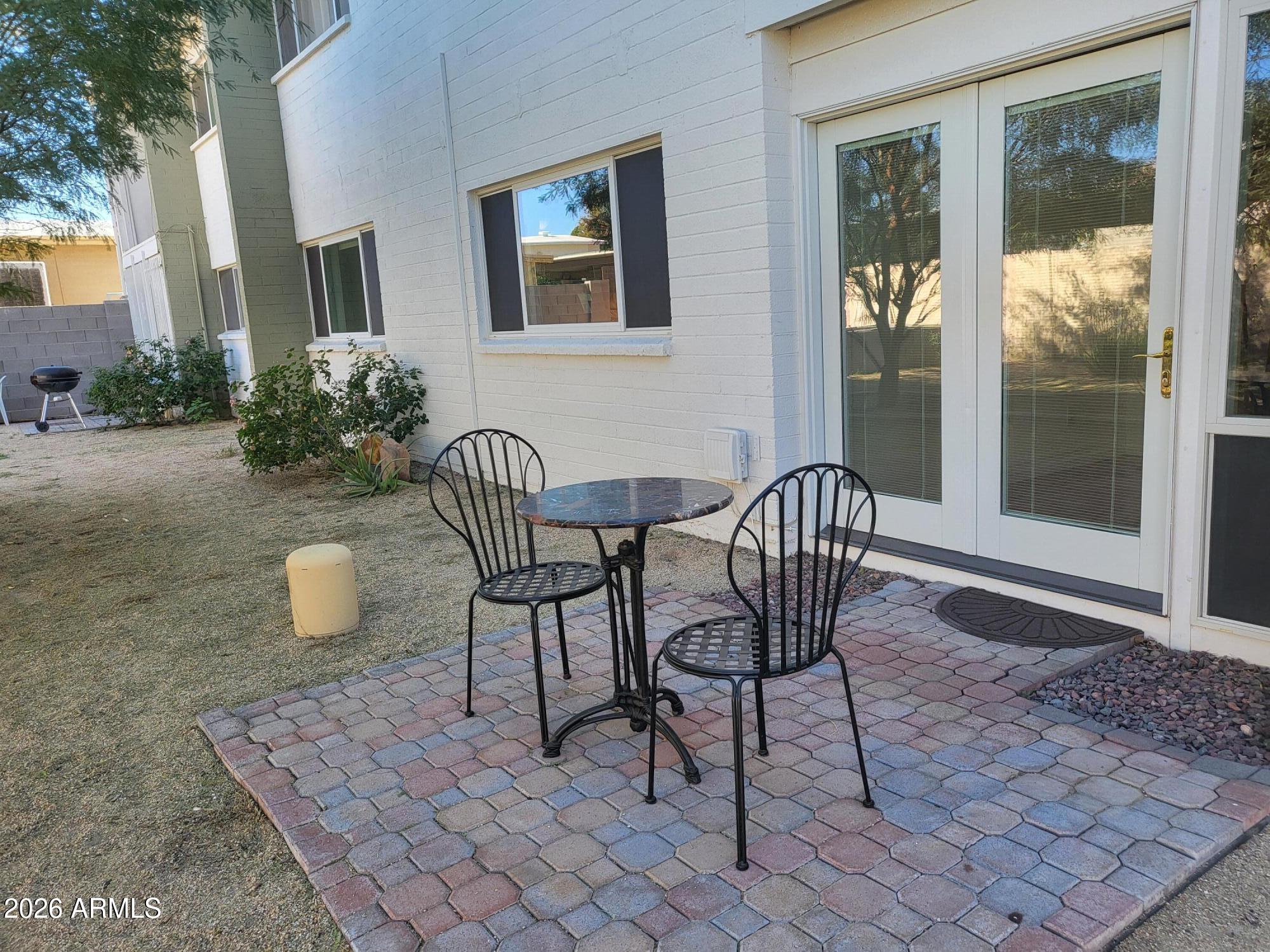 825 North Hayden Road, Unit C108 Scottsdale, AZ 85257 - Photo 11 of 34 a wooden bench sitting in front of a building