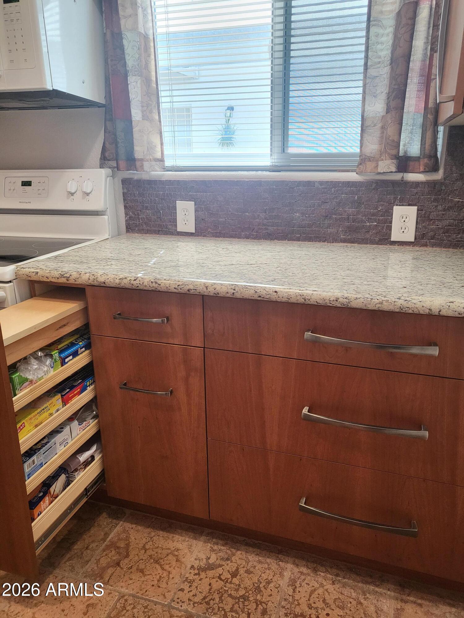 825 North Hayden Road, Unit C108 Scottsdale, AZ 85257 - Photo 14 of 34 a bathroom with a granite countertop sink and a mirror