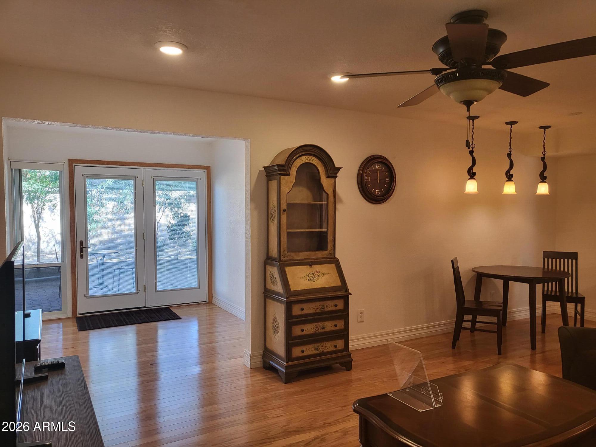 825 North Hayden Road, Unit C108 Scottsdale, AZ 85257 - Photo 2 of 34 a view of a livingroom with furniture and a floor to ceiling window