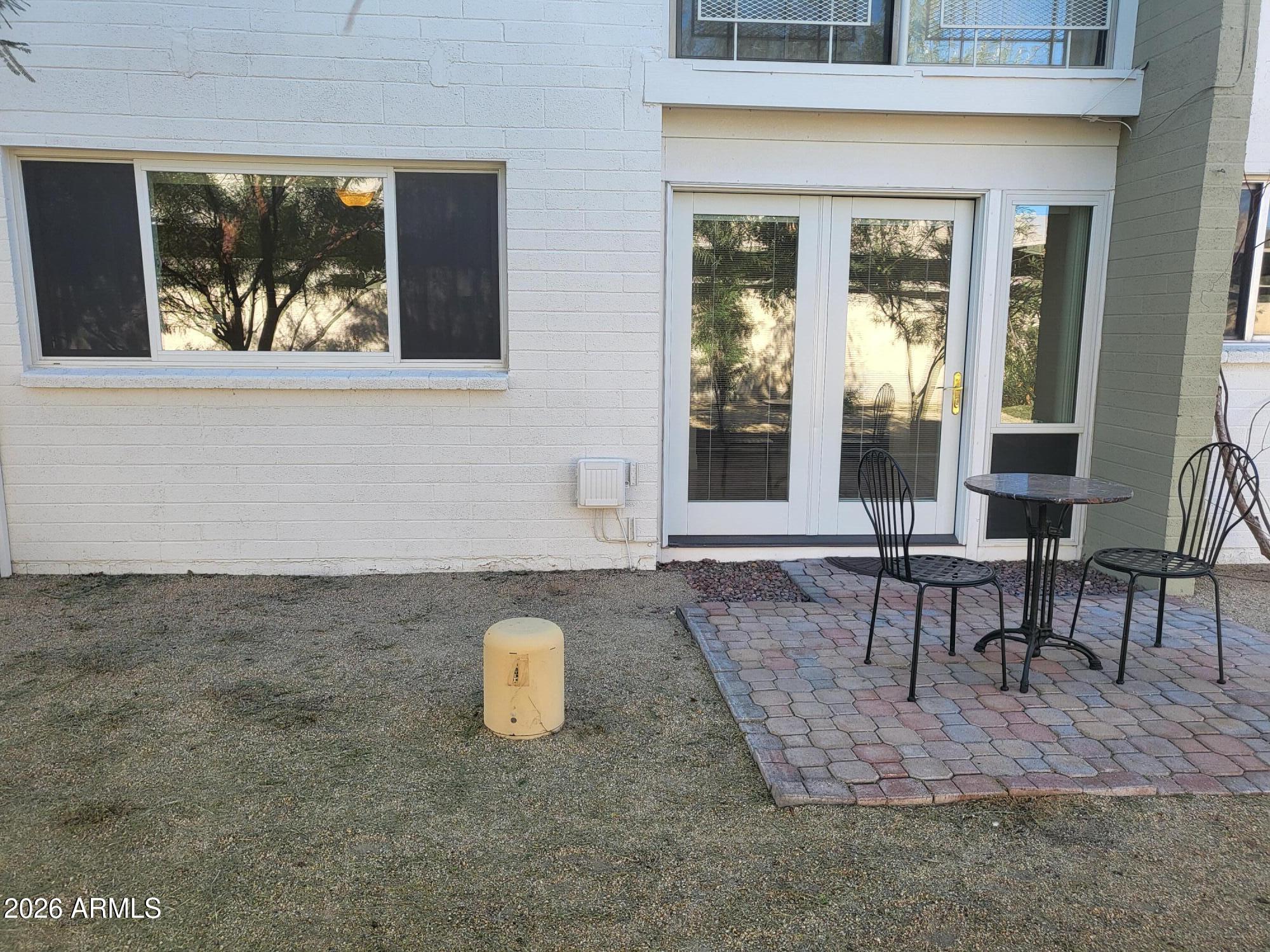 825 North Hayden Road, Unit C108 Scottsdale, AZ 85257 - Photo 24 of 34 a view of a dining room with a table and chairs