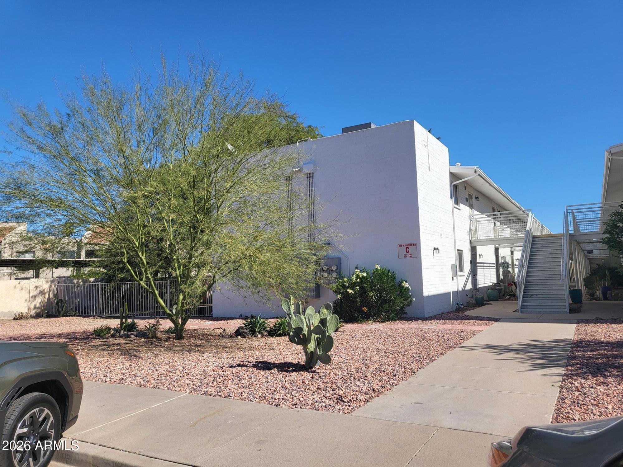 825 North Hayden Road, Unit C108 Scottsdale, AZ 85257 - Photo 27 of 34 a front view of a house with a yard