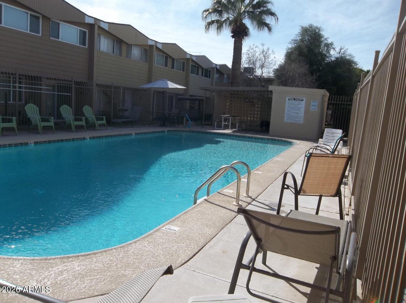 825 North Hayden Road, Unit C108 Scottsdale, AZ 85257 - Photo 31 of 34 a view of a chairs and table in backyard