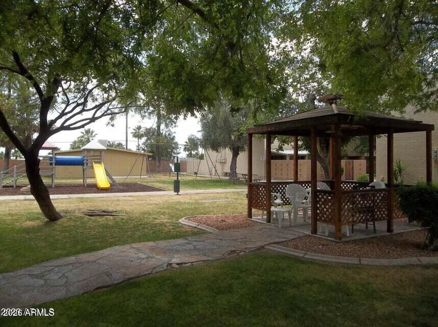 825 North Hayden Road, Unit C108 Scottsdale, AZ 85257 - Photo 32 of 34 a view of outdoor space yard and patio