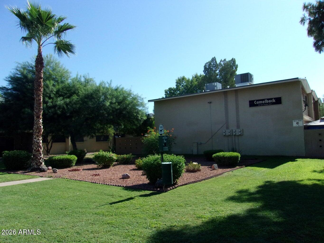 825 North Hayden Road, Unit C108 Scottsdale, AZ 85257 - Photo 34 of 34 a view of a backyard with potted plants and a large tree