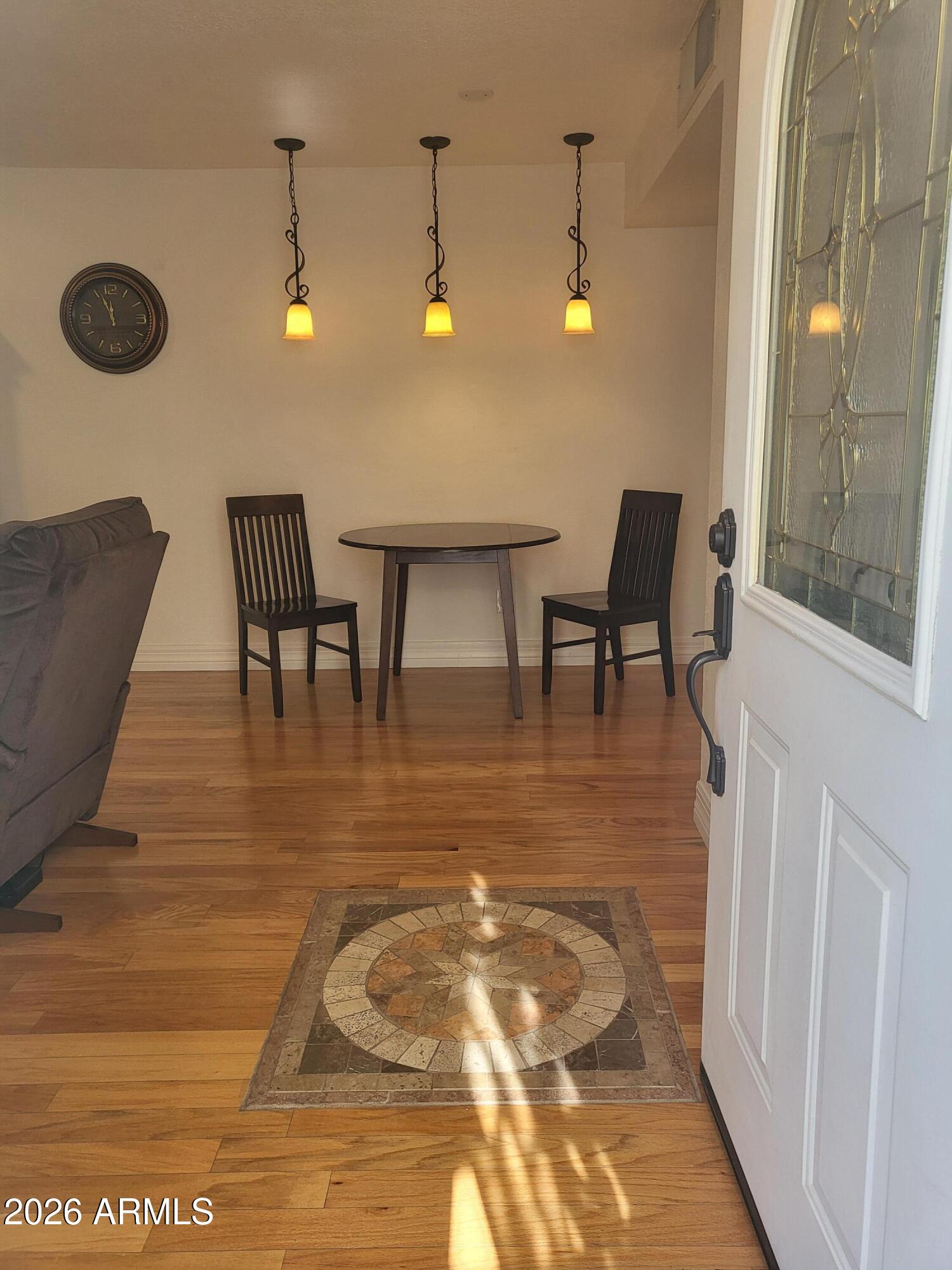 825 North Hayden Road, Unit C108 Scottsdale, AZ 85257 - Photo 4 of 34 a view of a dining room with furniture and chandelier