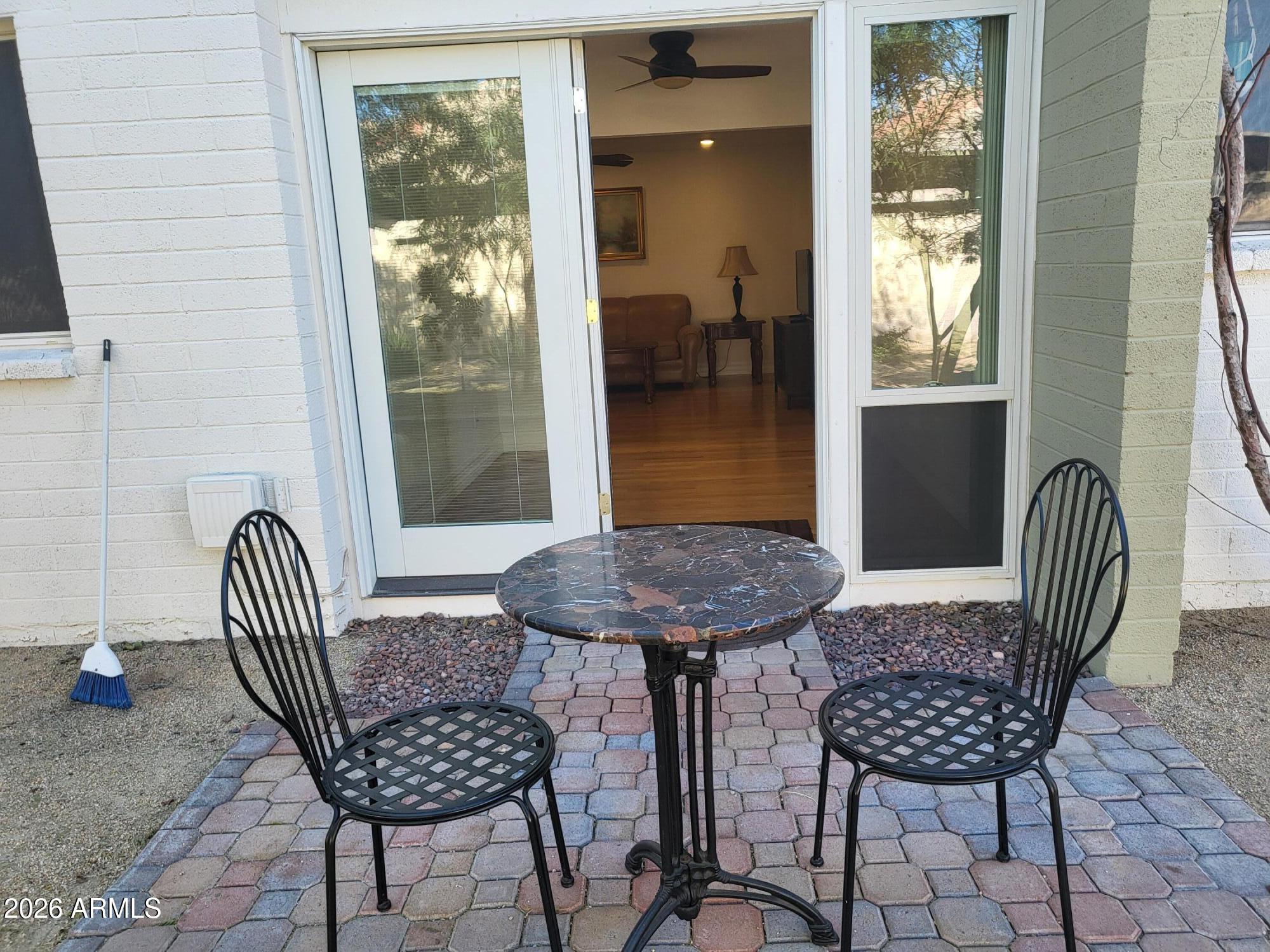 825 North Hayden Road, Unit C108 Scottsdale, AZ 85257 - Photo 10 of 34 a view of a chairs and table in the patio