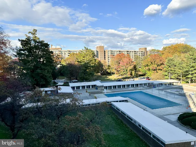 a view of a city with lawn chairs