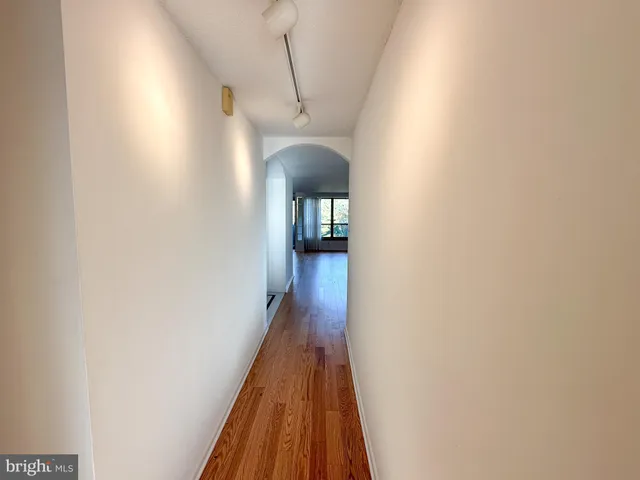 a bathroom with a sink double vanity mirror and a tub