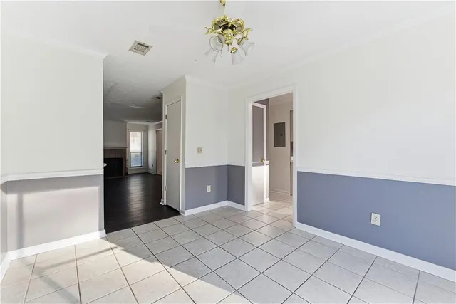 a view of a chandelier fan and entryway