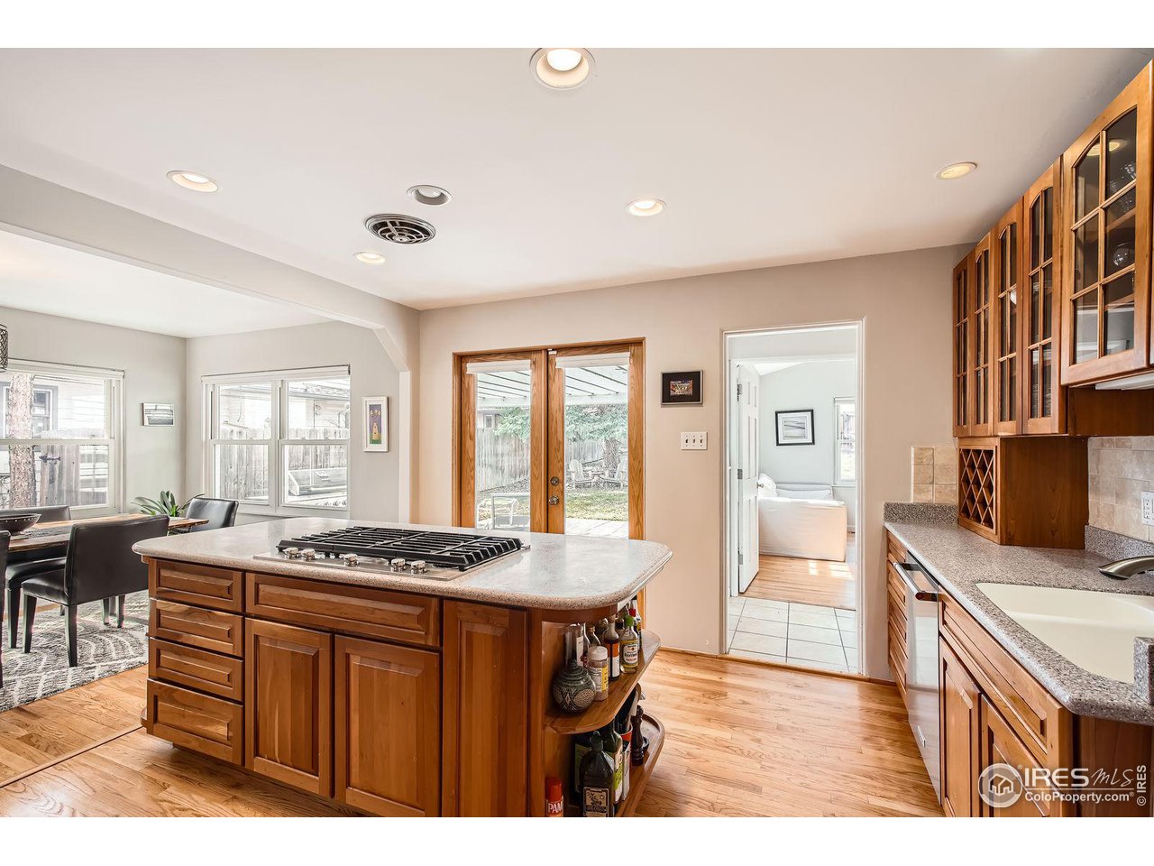 419 22nd Street Boulder, CO 80302 - Photo 11 of 38 a dining hall with stainless steel appliances granite countertop a stove and a sink