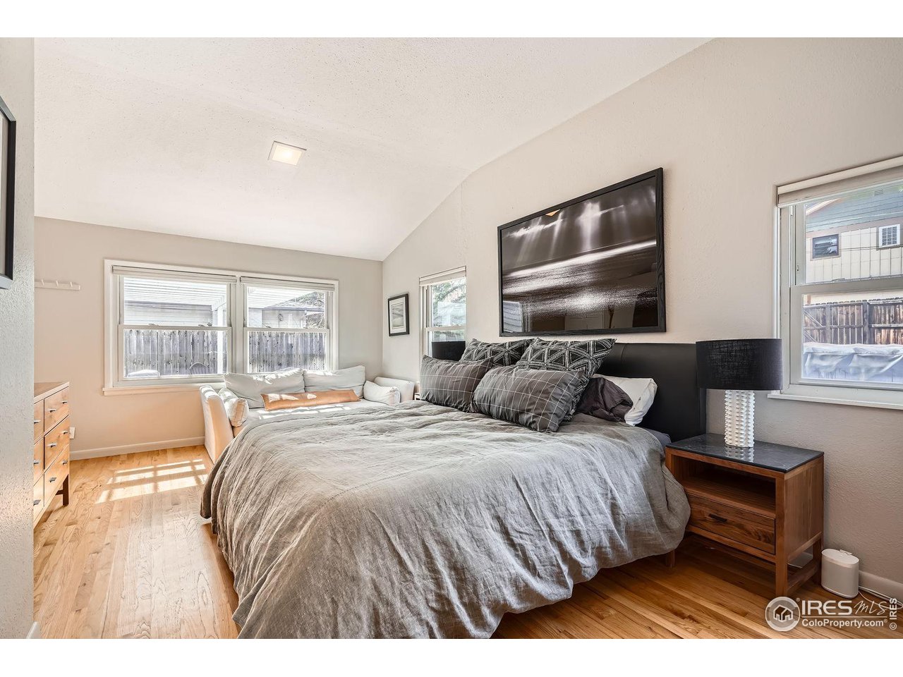 419 22nd Street Boulder, CO 80302 - Photo 12 of 38 a bedroom with a bed and wooden floor