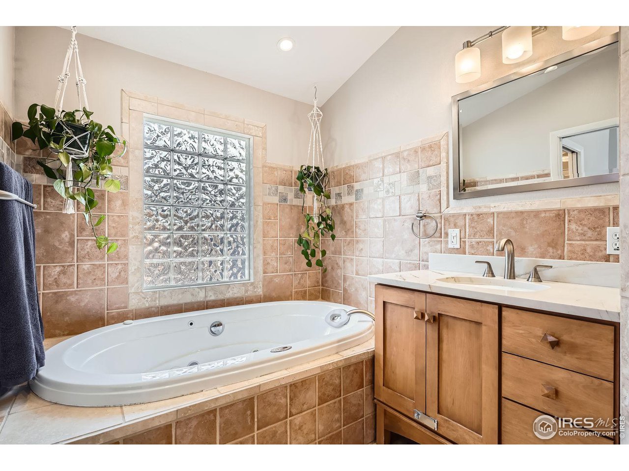 419 22nd Street Boulder, CO 80302 - Photo 16 of 38 a bathroom with a sink a bathtub and a sink