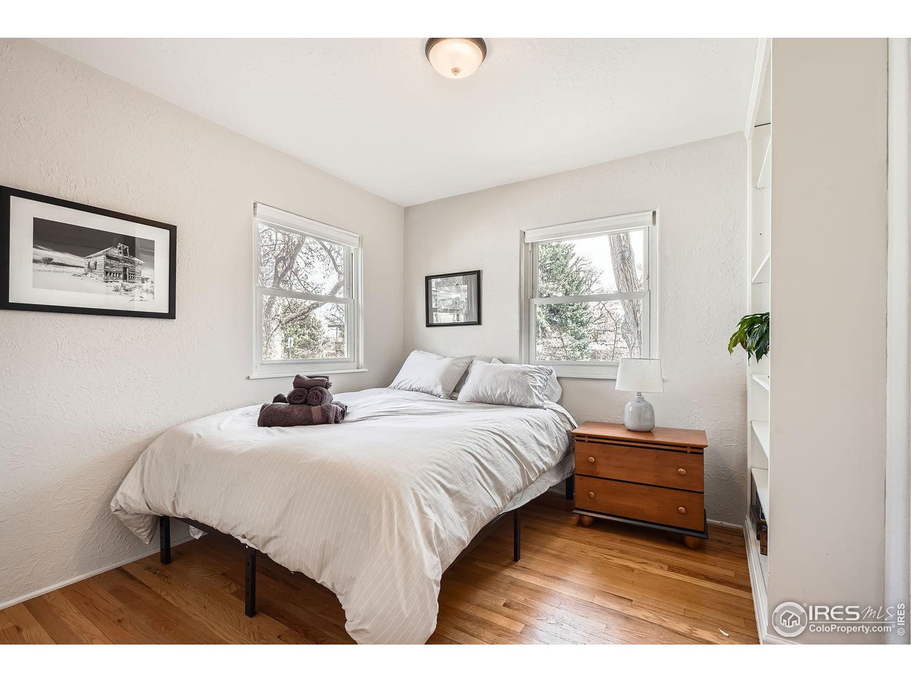 419 22nd Street Boulder, CO 80302 - Photo 17 of 38 a bedroom with a bed and window