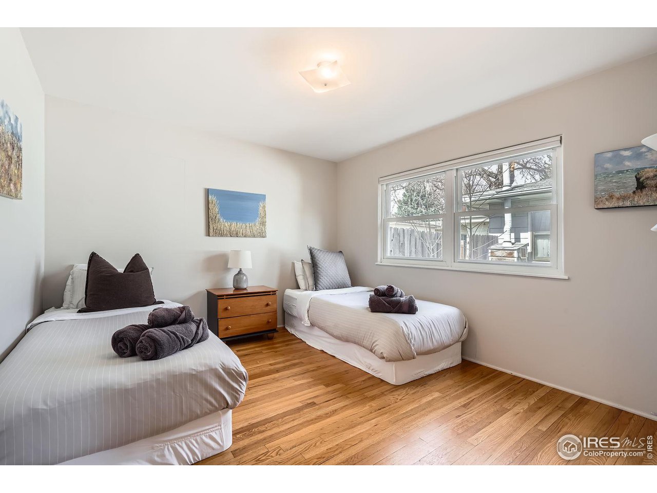 419 22nd Street Boulder, CO 80302 - Photo 19 of 38 a bedroom with bed window and couch