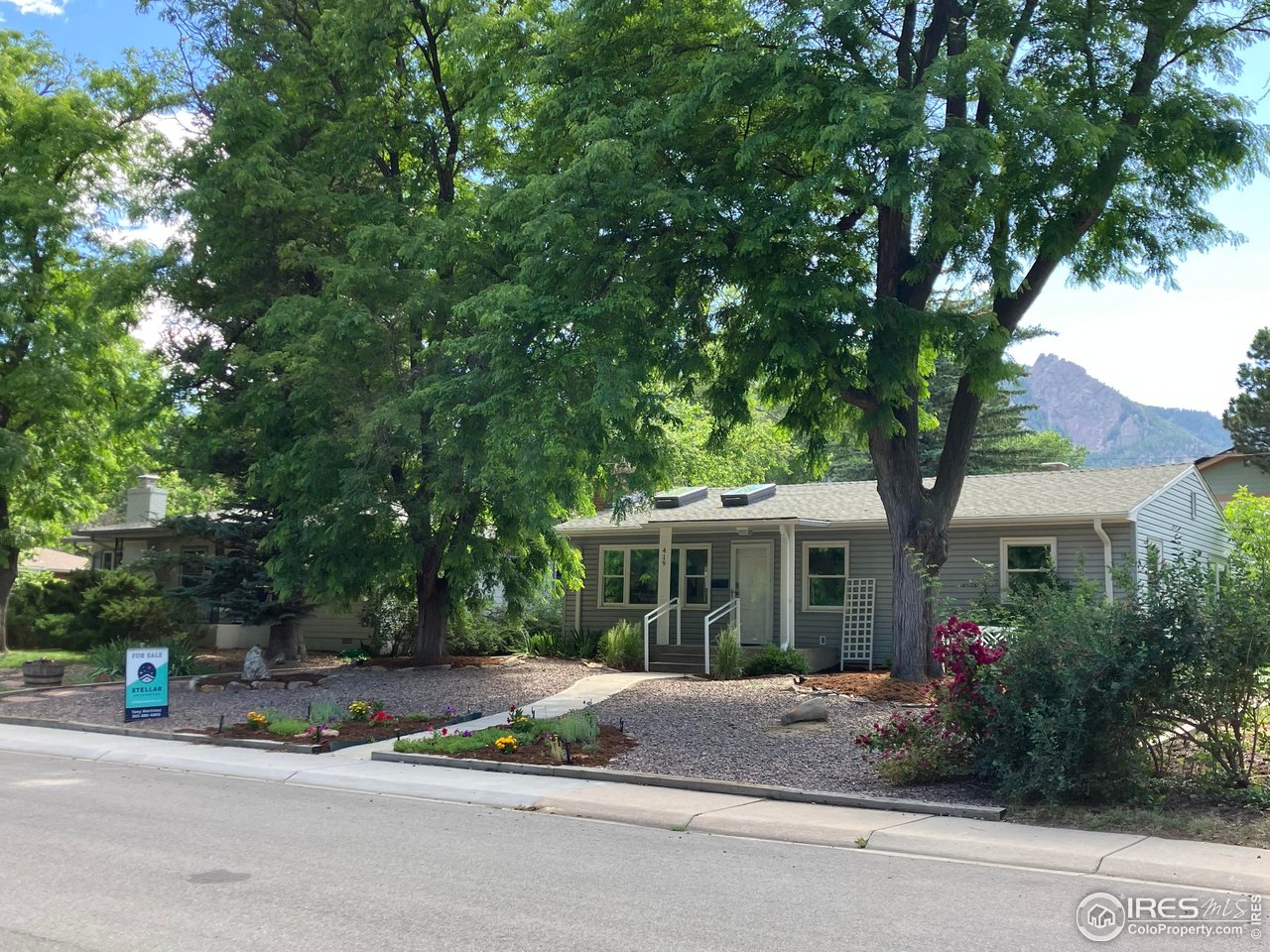 419 22nd Street Boulder, CO 80302 - Photo 2 of 38 a view of a house with a tree next to a yard