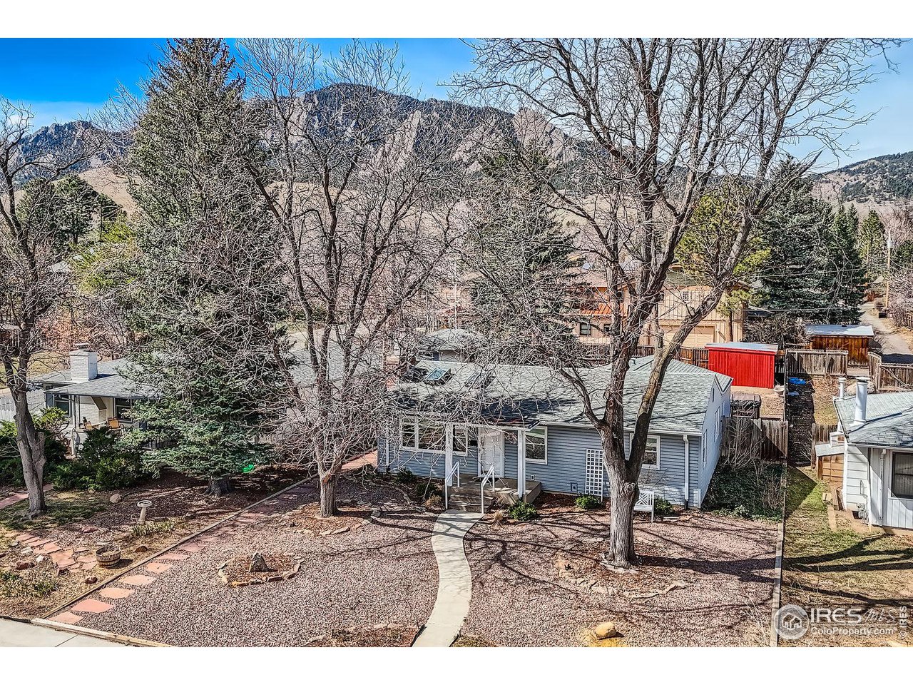 419 22nd Street Boulder, CO 80302 - Photo 34 of 38 a front view of a house with a yard