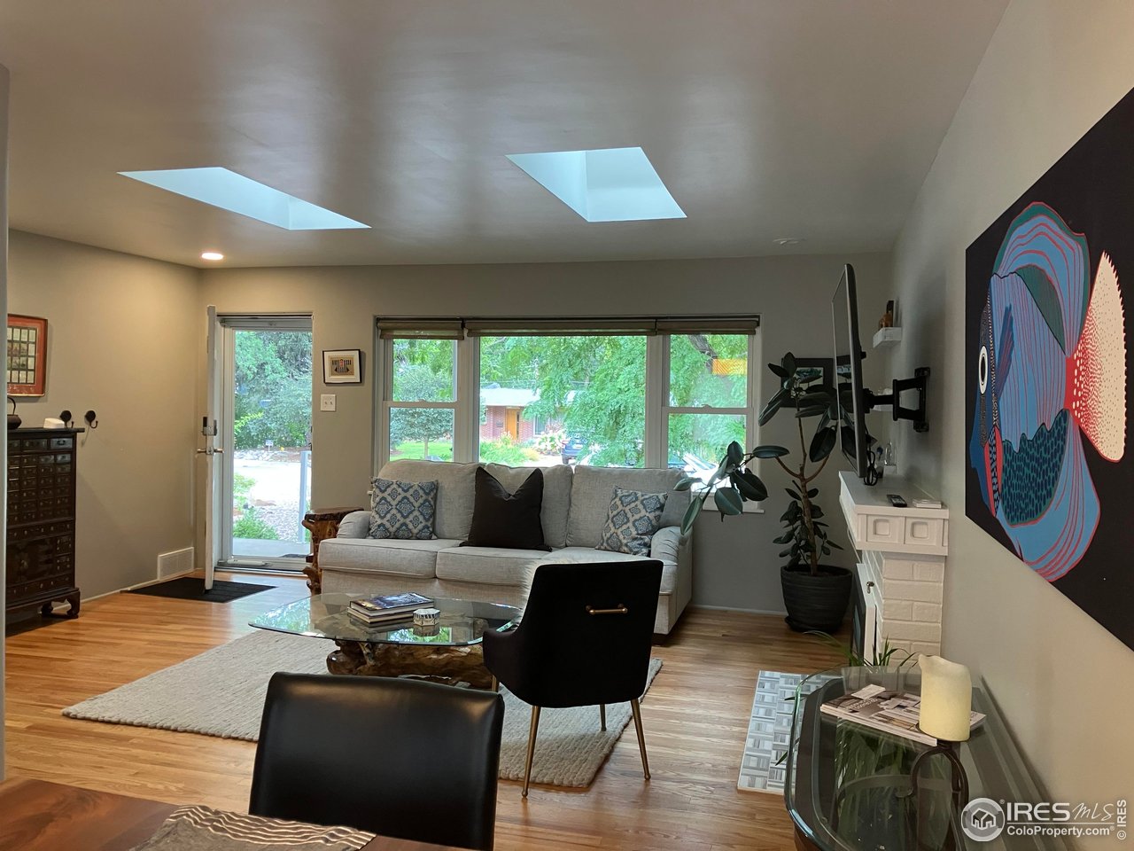 419 22nd Street Boulder, CO 80302 - Photo 4 of 38 a living room with furniture and a flat screen tv